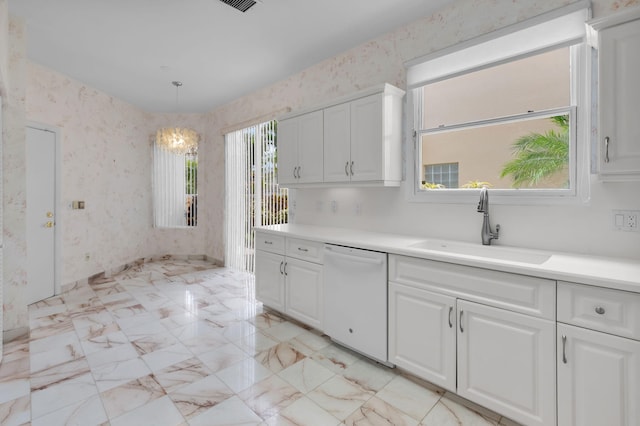7729 Travlers Tree Dr, Boca Raton, FL 33433 - kitchen featuring dishwasher, a sink, white cabinets, wallpapered walls, and light countertops