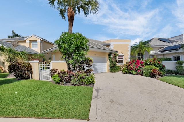 7729 Travlers Tree Dr, Boca Raton, FL 33433 - view of front of house with decorative driveway, a garage, stucco siding, and a gate
