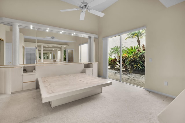 7729 Travlers Tree Dr, Boca Raton, FL 33433 - bedroom featuring access to exterior, light carpet, baseboards, and high vaulted ceiling