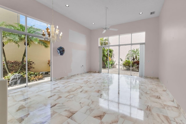 7729 Travlers Tree Dr, Boca Raton, FL 33433 - unfurnished dining area featuring a ceiling fan, a chandelier, recessed lighting, and marble finish floors