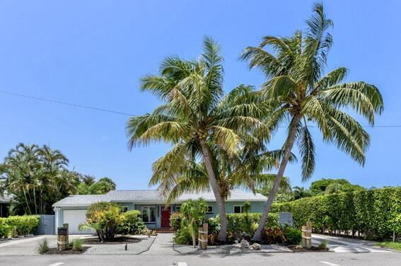 164 Bryn Mawr Dr, Lake Worth Beach, FL 33460 - view of front facade featuring a garage and driveway
