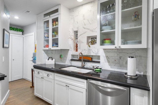 164 Bryn Mawr Dr, Lake Worth Beach, FL 33460 - kitchen with dishwasher, white cabinetry, backsplash, dark countertops, and glass insert cabinets
