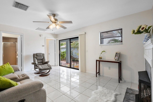 164 Bryn Mawr Dr, Lake Worth Beach, FL 33460 - living room featuring ceiling fan, a fireplace, and light tile patterned floors