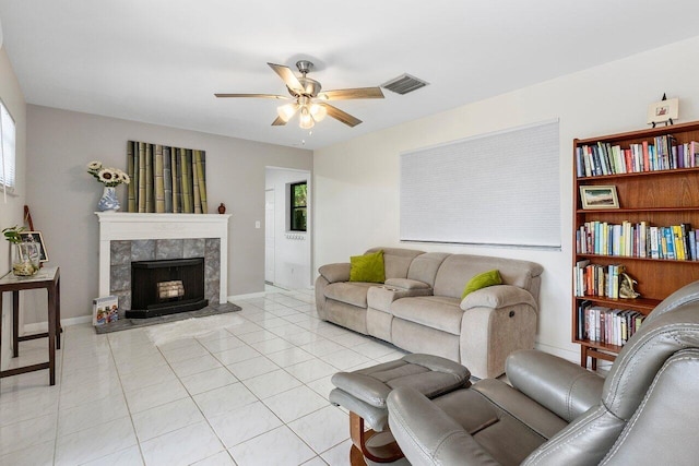 164 Bryn Mawr Dr, Lake Worth Beach, FL 33460 - living area featuring ceiling fan, light tile patterned floors, and a tile fireplace