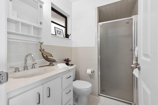 164 Bryn Mawr Dr, Lake Worth Beach, FL 33460 - full bathroom featuring vanity, a shower stall, tile walls, a wainscoted wall, and tile patterned flooring