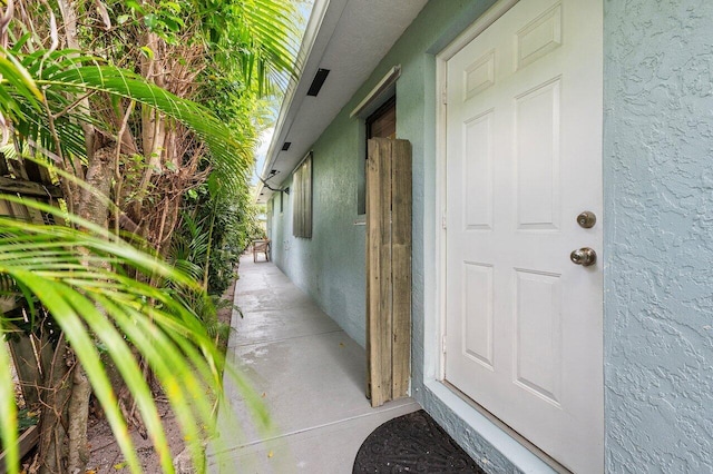 164 Bryn Mawr Dr, Lake Worth Beach, FL 33460 - property entrance featuring stucco siding