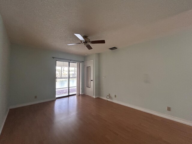 3400 NW 47th Ave Unit 3161, Coconut Creek, FL 33063 - spare room featuring wood finished floors, ceiling fan, a textured ceiling, and baseboards