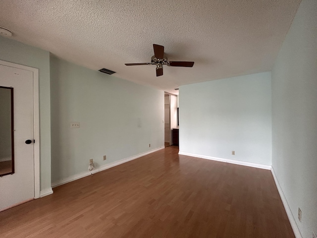 3400 NW 47th Ave Unit 3161, Coconut Creek, FL 33063 - spare room featuring wood finished floors, a ceiling fan, a textured ceiling, and baseboards