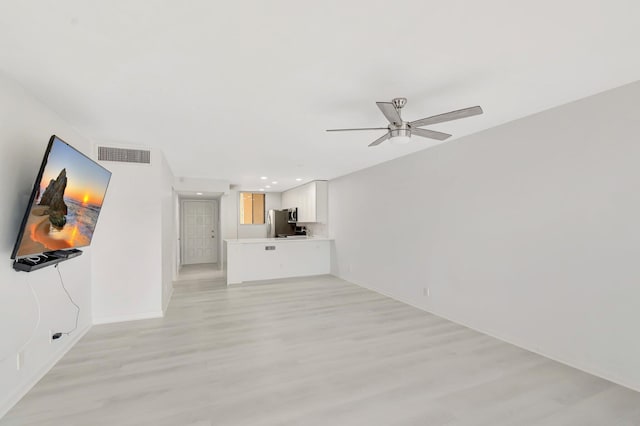 4345 Trevi Ct Unit 203, Lake Worth, FL 33467 - unfurnished living room with light wood-style flooring, ceiling fan, baseboards, and recessed lighting