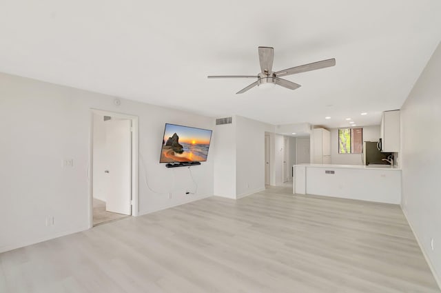 4345 Trevi Ct Unit 203, Lake Worth, FL 33467 - unfurnished living room featuring ceiling fan, light wood-style flooring, baseboards, and recessed lighting