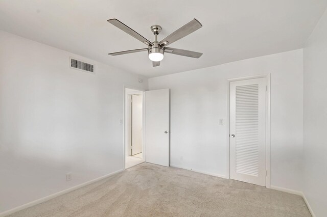 4345 Trevi Ct Unit 203, Lake Worth, FL 33467 - unfurnished bedroom featuring light colored carpet, baseboards, a ceiling fan, and a closet