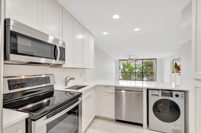 4345 Trevi Ct Unit 203, Lake Worth, FL 33467 - kitchen featuring washer / dryer, stainless steel appliances, a sink, recessed lighting, and ceiling fan