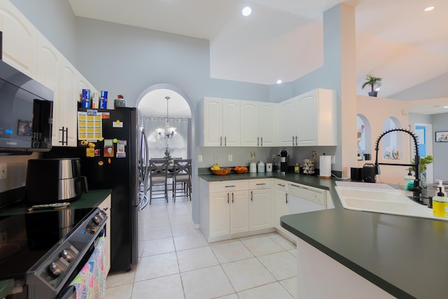 143 Monterey Way, Royal Palm Beach, FL 33411 - kitchen featuring a sink, range with electric stovetop, dark countertops, light tile patterned floors, and a chandelier
