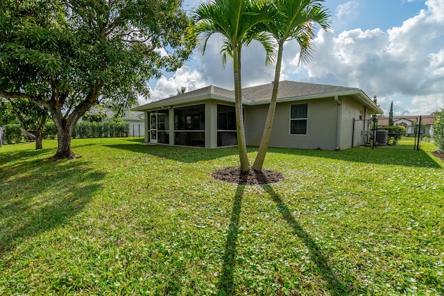 143 Monterey Way, Royal Palm Beach, FL 33411 - back of house featuring a gate, a sunroom, stucco siding, and central AC unit