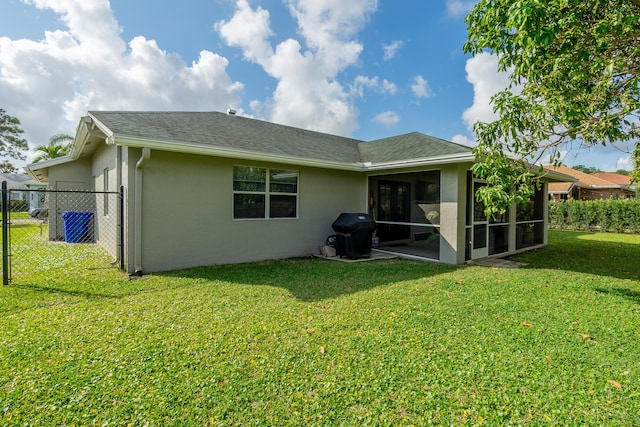 143 Monterey Way, Royal Palm Beach, FL 33411 - rear view of property featuring stucco siding, a sunroom, and a shingled roof