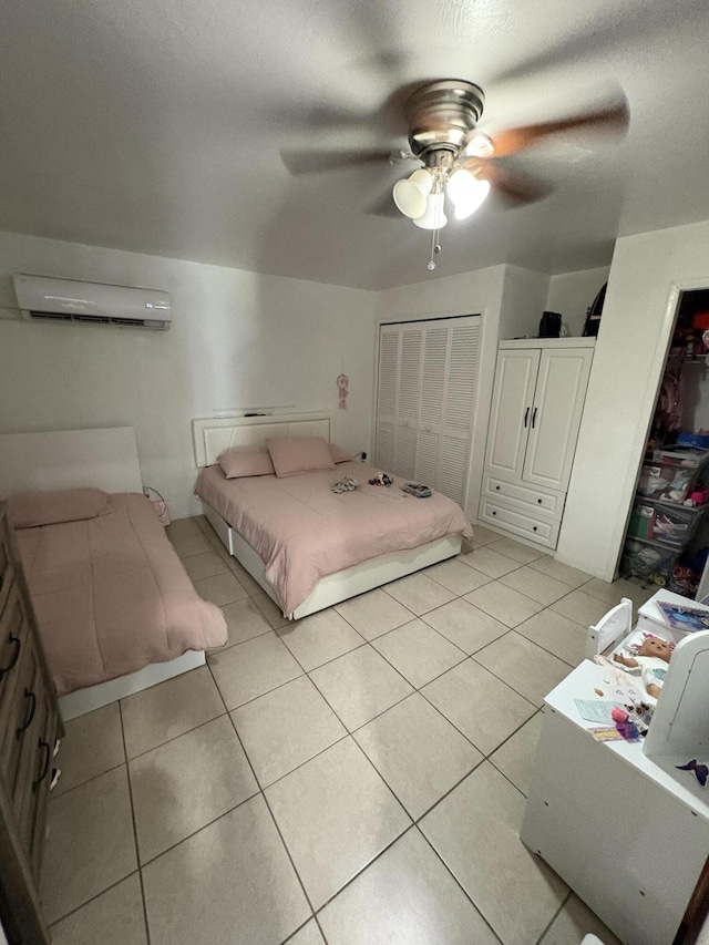 305 E 6th St, Lehigh Acres, FL 33972 - bedroom featuring a wall unit AC, light tile patterned floors, and ceiling fan