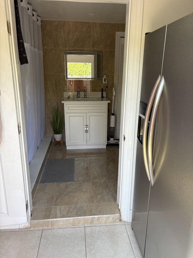 305 E 6th St, Lehigh Acres, FL 33972 - full bathroom featuring vanity, a shower with shower curtain, and tile patterned floors