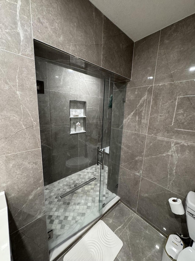 305 E 6th St, Lehigh Acres, FL 33972 - bathroom with toilet, a shower stall, and marble finish flooring