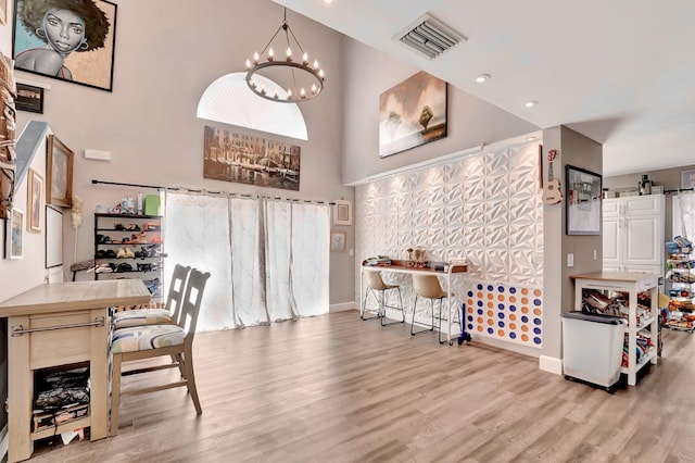 22360 Overture Cir, Boca Raton, FL 33428 - office space with a chandelier, wood finished floors, a high ceiling, and baseboards
