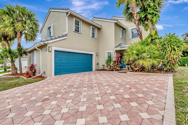 22360 Overture Cir, Boca Raton, FL 33428 - view of front of house with a garage, driveway, and stucco siding