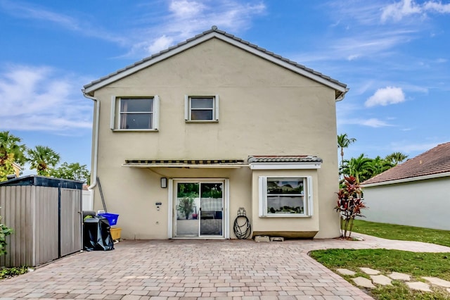 22360 Overture Cir, Boca Raton, FL 33428 - back of property with a patio area, stucco siding, and a tiled roof