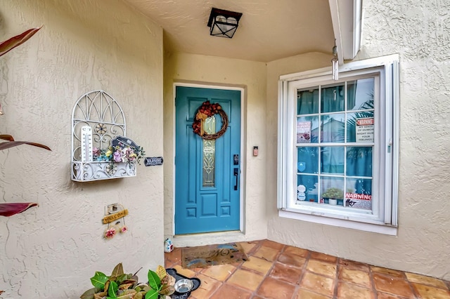 22360 Overture Cir, Boca Raton, FL 33428 - doorway to property with stucco siding