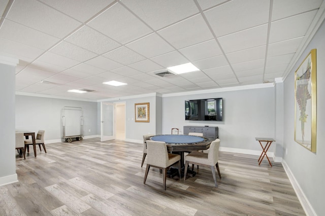 3546 S Ocean Blvd Unit 203, South Palm Beach, FL 33480 - dining area with light wood-style floors, baseboards, crown molding, and a drop ceiling