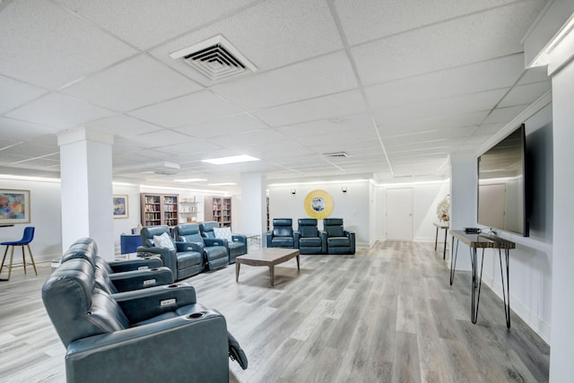 3546 S Ocean Blvd Unit 203, South Palm Beach, FL 33480 - living area with wood finished floors, baseboards, and a drop ceiling