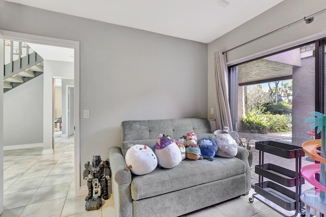 6650 Thornhill Ct, Boca Raton, FL 33433 - sitting room featuring stairway, tile patterned flooring, and baseboards