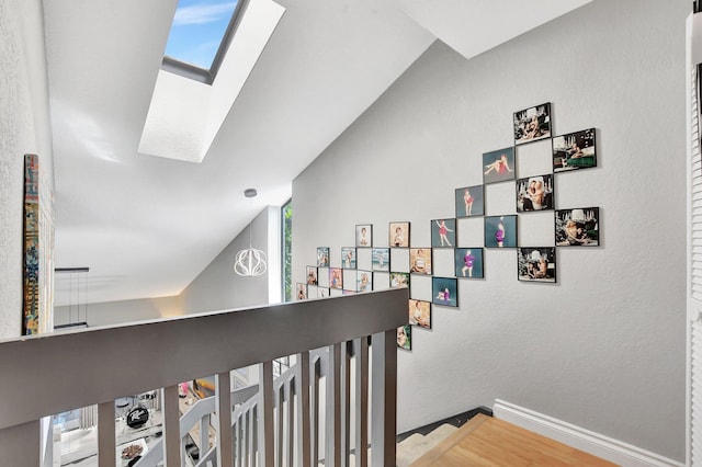 6650 Thornhill Ct, Boca Raton, FL 33433 - hallway featuring a skylight, baseboards, and wood finished floors
