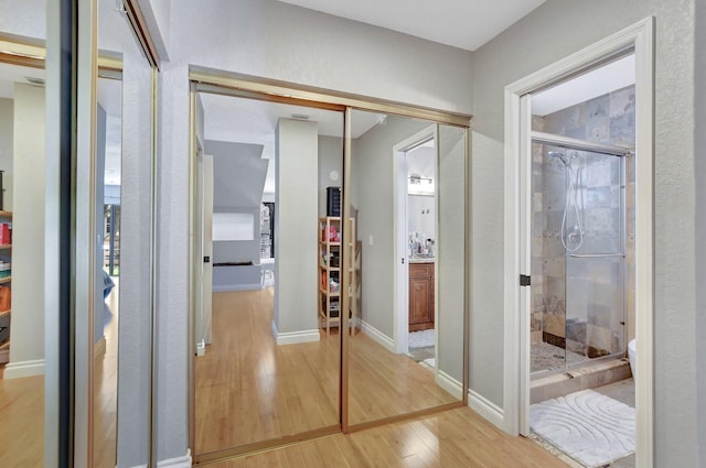 6650 Thornhill Ct, Boca Raton, FL 33433 - hallway featuring light wood finished floors and baseboards