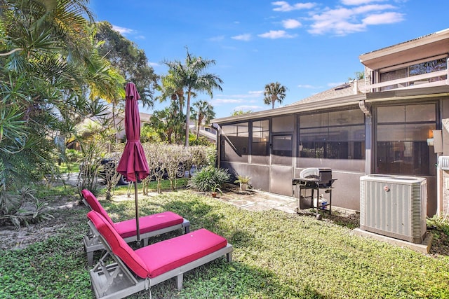 6650 Thornhill Ct, Boca Raton, FL 33433 - view of yard with central AC and a sunroom