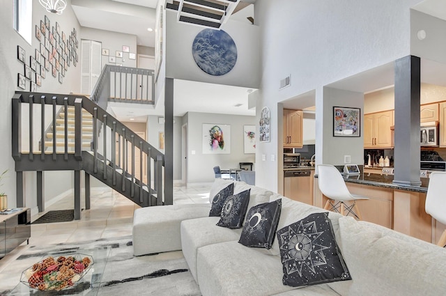 6650 Thornhill Ct, Boca Raton, FL 33433 - living room with stairs, a towering ceiling, and light tile patterned floors