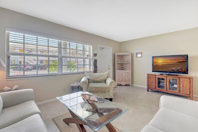 5505 N Ocean Blvd Unit 13-105, Ocean Ridge, FL 33435 - living area featuring baseboards and light tile patterned floors