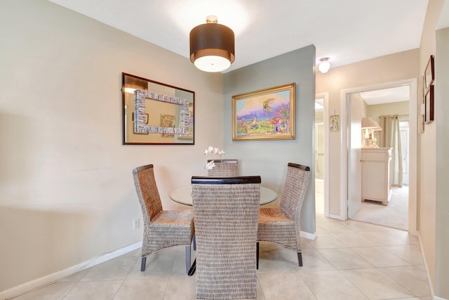 5505 N Ocean Blvd Unit 13-105, Ocean Ridge, FL 33435 - dining room featuring baseboards and light tile patterned floors