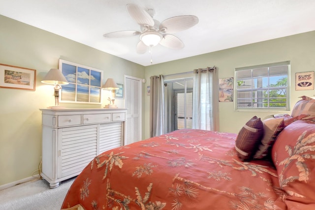 5505 N Ocean Blvd Unit 13-105, Ocean Ridge, FL 33435 - carpeted bedroom featuring multiple windows, access to outside, baseboards, and ceiling fan