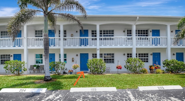 5505 N Ocean Blvd Unit 13-105, Ocean Ridge, FL 33435 - multi unit property with uncovered parking, a front yard, and stucco siding