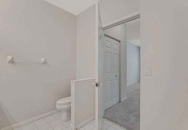 7886 Laina Ln Unit 2, Boynton Beach, FL 33437 - bathroom featuring toilet, baseboards, and tile patterned flooring