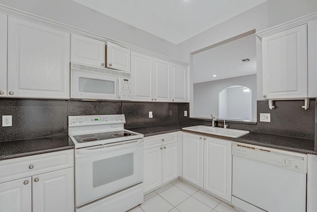 7886 Laina Ln Unit 2, Boynton Beach, FL 33437 - kitchen with white appliances, a sink, dark countertops, and backsplash