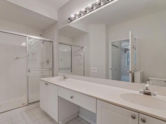 7886 Laina Ln Unit 2, Boynton Beach, FL 33437 - full bath with double vanity, a stall shower, toilet, and tile patterned floors