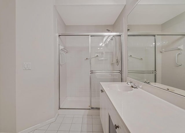 7886 Laina Ln Unit 2, Boynton Beach, FL 33437 - bathroom with tile patterned floors, a stall shower, vanity, and baseboards
