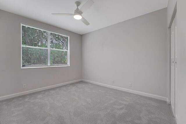 7886 Laina Ln Unit 2, Boynton Beach, FL 33437 - carpeted empty room with ceiling fan and baseboards