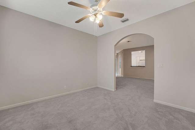 7886 Laina Ln Unit 2, Boynton Beach, FL 33437 - carpeted empty room featuring arched walkways, a ceiling fan, and baseboards