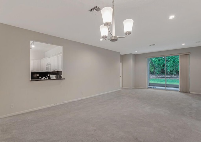 7886 Laina Ln Unit 2, Boynton Beach, FL 33437 - carpeted spare room featuring a chandelier, baseboards, and recessed lighting
