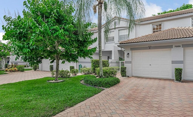 7886 Laina Ln Unit 2, Boynton Beach, FL 33437 - townhome / multi-family property with decorative driveway, stucco siding, and a tiled roof