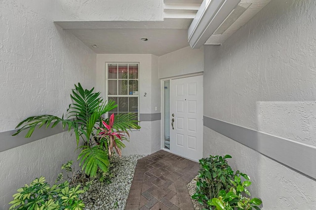7886 Laina Ln Unit 2, Boynton Beach, FL 33437 - view of exterior entry with stucco siding
