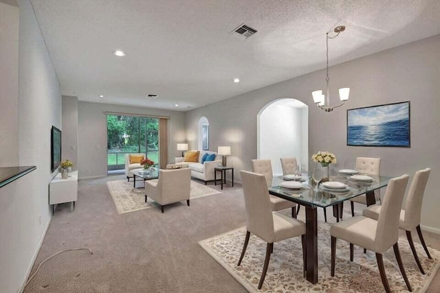 7886 Laina Ln Unit 2, Boynton Beach, FL 33437 - dining area with arched walkways, light colored carpet, a chandelier, baseboards, and recessed lighting