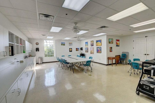 7886 Laina Ln Unit 2, Boynton Beach, FL 33437 - dining space featuring ceiling fan, a drop ceiling, and baseboards