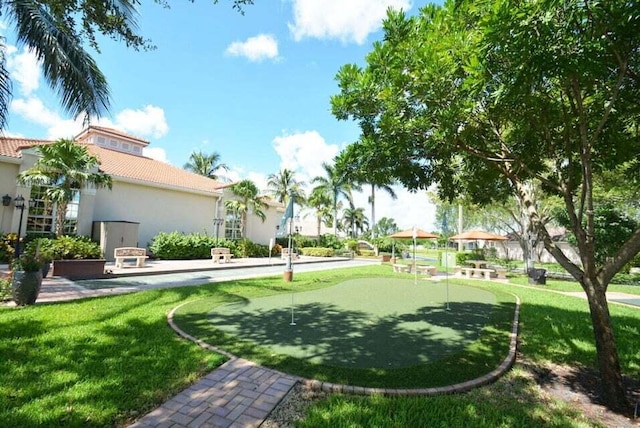 7886 Laina Ln Unit 2, Boynton Beach, FL 33437 - view of green lawn featuring a putting green
