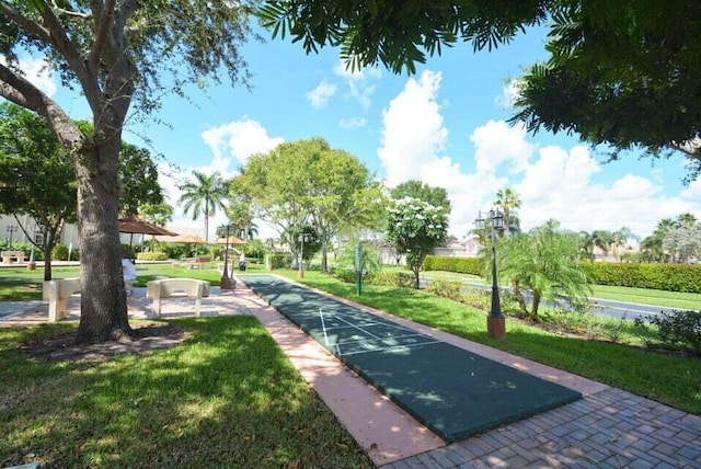 7886 Laina Ln Unit 2, Boynton Beach, FL 33437 - view of home's community featuring shuffleboard and a yard